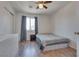 Bright bedroom with wood-look floors, and ceiling fan at 8627 Roping Rodeo Ave # 103, Las Vegas, NV 89178