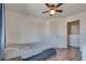 Cozy bedroom featuring wood-look floors and ceiling fan at 8627 Roping Rodeo Ave # 103, Las Vegas, NV 89178