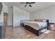 Bedroom with wood-look floors, two beds and ceiling fan at 8627 Roping Rodeo Ave # 103, Las Vegas, NV 89178