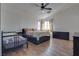 Spacious bedroom with wood-look floors, two beds and ceiling fan at 8627 Roping Rodeo Ave # 103, Las Vegas, NV 89178