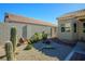 Landscaped backyard with desert plants and brick pathway at 8772 Rio Grande Falls Ave, Las Vegas, NV 89178