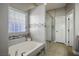 Bathroom boasts a soaking tub and walk-in shower at 8772 Rio Grande Falls Ave, Las Vegas, NV 89178