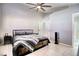 Spacious bedroom with wood-like platform bed and tiled floors at 8836 Big Bear Pines Ave, Las Vegas, NV 89143