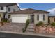 Single-story home with two-car garage and attractive landscaping at 9196 Oakdale Ranch Ct, Las Vegas, NV 89139