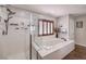 Spa-like bathroom with soaking tub and walk in shower at 9361 Hilgard Ave, Las Vegas, NV 89178