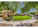 Landscaped community green space with walking path and seating at 9361 Hilgard Ave, Las Vegas, NV 89178