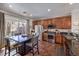 Eat-in kitchen with dark wood cabinets and tile floors at 9361 Hilgard Ave, Las Vegas, NV 89178