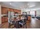 Spacious kitchen with island, stainless steel appliances, and dark wood cabinets at 9361 Hilgard Ave, Las Vegas, NV 89178