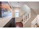 Modern staircase with simple, white railings and wood floors at 9361 Hilgard Ave, Las Vegas, NV 89178