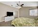 Bright bedroom with ceiling fan and mirrored closet doors at 9636 Swan Bay Dr, Las Vegas, NV 89117