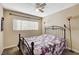 Bedroom featuring a metal bed frame and window blinds at 9636 Swan Bay Dr, Las Vegas, NV 89117