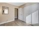 Bright bedroom with wood-look floors and ample closet space at 9636 Swan Bay Dr, Las Vegas, NV 89117