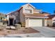 Two-story house with attached garage and landscaping at 9636 Swan Bay Dr, Las Vegas, NV 89117