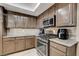 Modern kitchen with stainless steel appliances and granite countertops at 9636 Swan Bay Dr, Las Vegas, NV 89117