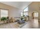 Living room with vaulted ceiling, neutral decor, and hardwood floor at 9636 Swan Bay Dr, Las Vegas, NV 89117