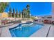 Inviting backyard oasis featuring a sparkling pool and relaxing patio area at 9636 Swan Bay Dr, Las Vegas, NV 89117