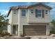 Two-story house with a two-car garage and neutral color scheme at 10039 Sir Atlas Ct, Las Vegas, NV 89148