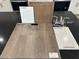 Selection of flooring, paint, cabinets, quartz and faucet samples for the home's design at 10039 Sir Atlas Ct, Las Vegas, NV 89148