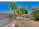 Landscaped backyard with gravel and desert plants at 10201 Premia Pl, Las Vegas, NV 89135