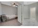 Small bedroom with a daybed and access to the hallway at 10201 Premia Pl, Las Vegas, NV 89135