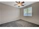 Bedroom with grey carpet and ceiling fan at 10201 Premia Pl, Las Vegas, NV 89135