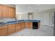 Well-equipped kitchen with wood cabinets and blue countertops at 10201 Premia Pl, Las Vegas, NV 89135