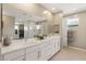 Spa-like bathroom with double vanity, walk-in shower, and large soaking tub at 10286 Jade Gardens Dr, Las Vegas, NV 89135