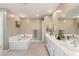 Bathroom with double vanity, large soaking tub, and elegant design at 10286 Jade Gardens Dr, Las Vegas, NV 89135