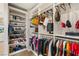 Well-organized closet with shoe storage and hanging rods at 10286 Jade Gardens Dr, Las Vegas, NV 89135