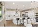 Modern kitchen with white cabinets, stainless steel appliances, and large island at 10286 Jade Gardens Dr, Las Vegas, NV 89135