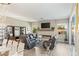 Relaxing living room with fireplace, leather seating, and large windows at 10286 Jade Gardens Dr, Las Vegas, NV 89135