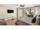 Main bedroom with plush carpet, private balcony access, and stunning views at 10286 Jade Gardens Dr, Las Vegas, NV 89135