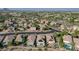 Aerial view of homes, showcasing a neighborhood with a pool at 10509 India Hawthorn Ave, Las Vegas, NV 89144