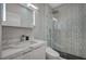 Modern bathroom with marble vanity, patterned shower, and sleek fixtures at 10509 India Hawthorn Ave, Las Vegas, NV 89144