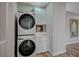 Convenient laundry room with stacked washer and dryer at 10509 India Hawthorn Ave, Las Vegas, NV 89144