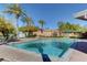 Sparkling community pool with lounge chairs at 10509 India Hawthorn Ave, Las Vegas, NV 89144