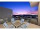 Peaceful balcony with seating area and stunning sunset view at 10955 Mojave Spring Dr, Las Vegas, NV 89135