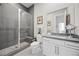 Bathroom with gray tiled shower and vanity at 10955 Mojave Spring Dr, Las Vegas, NV 89135