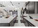 Spacious kitchen island with white countertops and dark cabinetry at 10955 Mojave Spring Dr, Las Vegas, NV 89135