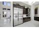 Modern kitchen with stainless steel appliances and dark cabinetry at 10955 Mojave Spring Dr, Las Vegas, NV 89135