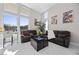 Relaxing living room with large windows, comfortable seating, and marble floors at 10955 Mojave Spring Dr, Las Vegas, NV 89135