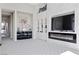 Living room featuring a modern fireplace and built-in shelving at 10955 Mojave Spring Dr, Las Vegas, NV 89135