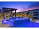 Stunning pool and spa at dusk with blue lighting at 10955 Mojave Spring Dr, Las Vegas, NV 89135