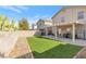 Artificial turf backyard with covered patio and grill at 1129 Majestic Canyon St, Henderson, NV 89052