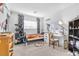 Bedroom with cat tree, desk, and built-in shelving at 1129 Majestic Canyon St, Henderson, NV 89052