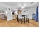 Bright dining area open to the living room and kitchen featuring sleek laminate floors at 1129 Majestic Canyon St, Henderson, NV 89052