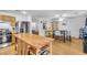 Kitchen with wood cabinets, stainless steel appliances, and an island with butcher block top at 1129 Majestic Canyon St, Henderson, NV 89052