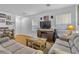 Bright living room with hardwood floors, comfy sofas, and a fireplace at 1129 Majestic Canyon St, Henderson, NV 89052