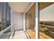 Open-air balcony provides city views and natural light into the indoor living space at 125 E Harmon Ave # 1020, Las Vegas, NV 89109