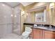 The bathroom features a spacious glass shower and vanity with a dark countertop at 125 E Harmon Ave # 1020, Las Vegas, NV 89109